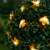 Méhecskés LED szolár fényfüzér decorating a bush