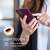 Woman holding a purple Kwmobile silicone phone case for Nokia G21/G11, soft touch, elegant matte finish