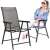 Springos black and grey garden chairs with woman sitting