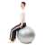 Nő ül egy Springos fitness labdán, 75cm, szürke