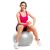 Woman exercising with Springos grey gym ball and dumbbell