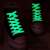 Pair of white glow in the dark shoelaces on black sneakers, Envisage brand