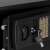 Springos black metal safe with electronic lock, close-up of the keyhole and key