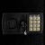 Close-up of the digital keypad and key lock on a Springos black metal security safe