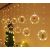 LED curtain lights with Christmas figures in a room