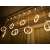 LED curtain lights with Christmas figures, warm white, 3m, 125 LEDs, hanging on a curtain rod