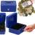 Springos blue metal cash box with compartments, key lock, and handle, open with hand, with money inside