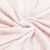 Close-up of soft pink fleece blanket texture