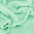 Close-up of Springos green fleece blanket, soft texture