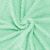 Detailed view of Springos green fleece blanket swirl pattern