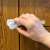 Hand opening Springos white cabinet and drawer lock on a cabinet