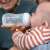 Baby drinking from Philips Avent Natural Response 260ml baby bottle with AirFree vent, 1m+