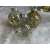 Group of Springos clear Christmas ornaments with gold glitter, beads, and feather designs.
