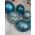 Various blue Christmas ornaments by Springos on white fur