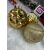 Springos gold Christmas ornaments on white fur