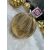 Springos gold textured Christmas tree ornament on white fur
