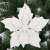 White glitter poinsettia Christmas tree ornament, Springos, on a Christmas tree