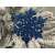 Blue glitter snowflake Christmas ornament on a Christmas tree