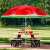 Springos watermelon print beach umbrella shading a picnic table