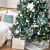 Christmas tree decorated with light blue and white ornaments