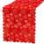 Red table runner with white snowflakes, angled view