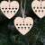 Springos wooden heart ornament hanging on a Christmas tree