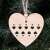 Springos wooden heart ornament hanging on a Christmas tree