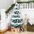 Springos 1.8m realistic extra-full artificial Christmas tree decorated with white ornaments and feather garland in a home setting