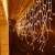 Springos icicle LED lights hanging on a balcony, warm white, 300 LED