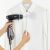 Rayen 6222 black handheld garment steamer in use on white shirt