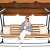 Woman relaxing on Springos 4-person garden swing bed with adjustable canopy - brown-beige striped