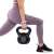 Woman using Springos 10kg kettlebell for lunges