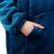 Close-up of Springos oversized hoodie blanket in blue, showing pocket detail