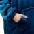 Close-up of Springos oversized hoodie blanket in blue, showing pocket detail