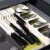 Springos green cutlery organizer in drawer with knives, forks, and spoons