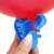 Close-up of Springos balloon tying tool securing a balloon