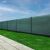 Privacy fence covered with Springos green shade netting