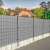 Springos light grey fence tape, installed on a fence, providing privacy and wind protection