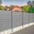 Springos light grey fence tape, installed on a fence, providing privacy and wind protection
