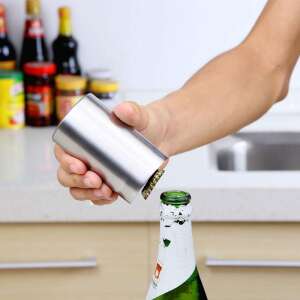 Hand holding stainless steel automatic bottle opener, opening a beer bottle - Bottle Opener