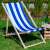 Springos blue and white striped wooden deck chair in a garden