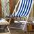 Springos blue and white striped wooden deck chair on a patio