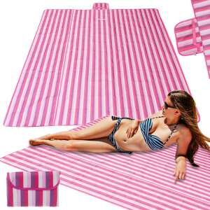 Pink striped beach blanket with woman laying on it - Beach mat