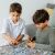 Dzieci układające puzzle Trefl Psi Patrol