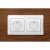 White double electrical outlet with plug protectors installed