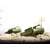 Green plastic toy tank with camouflage pattern