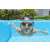 Child swimming in a pool wearing Bestway 21002 blue and orange swimming goggles