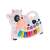White and black cow shaped musical toy with piano keys and animal sound buttons