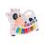 White and black cow shaped musical toy with piano keys and animal sound buttons