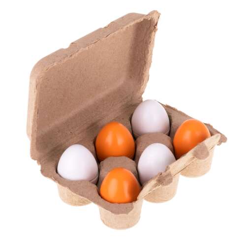 Spielzeug-Ei aus Holz in einer Schachtel
